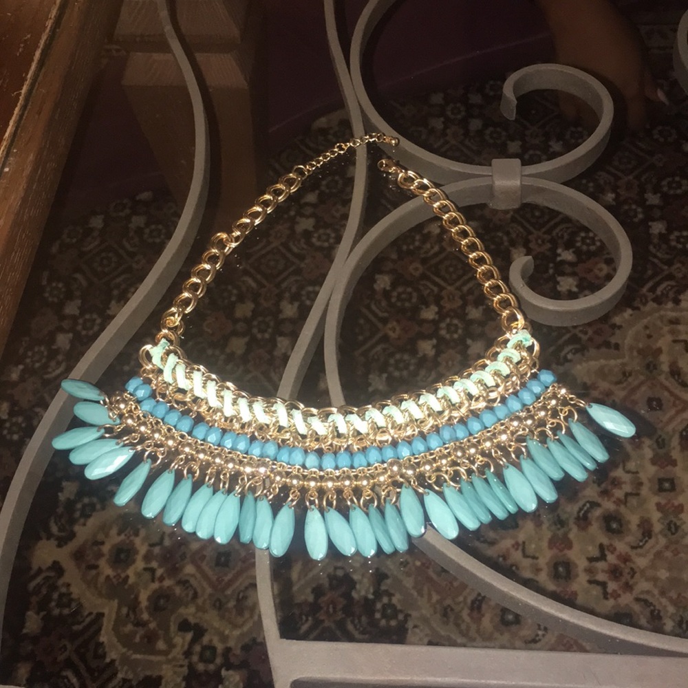 Gold necklace with gold and teal embellishments